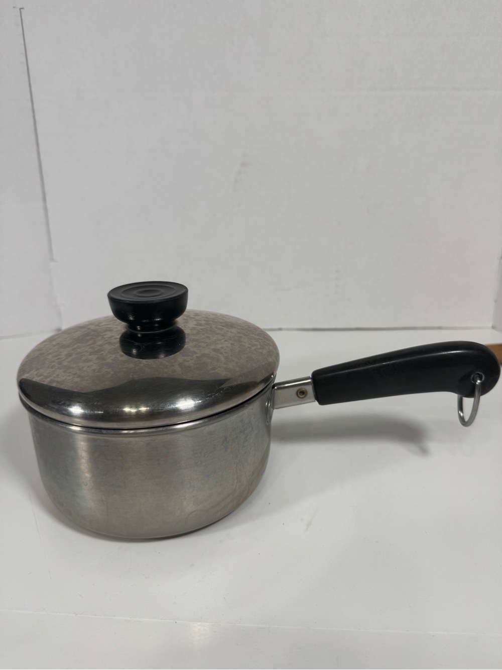 Stainless Steel Saucepan with Black Handle and Lid